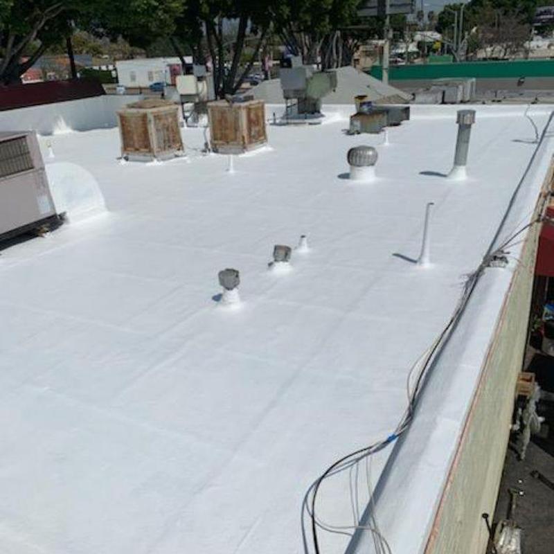 Commercial flat roof with ventilation pipes and HVAC units Commercial flat roof with ventilation pipes and HVAC units