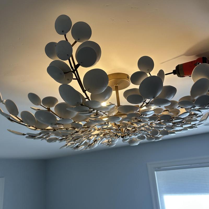 Decorative ceiling light fixture installation in office Decorative ceiling light fixture installation in office