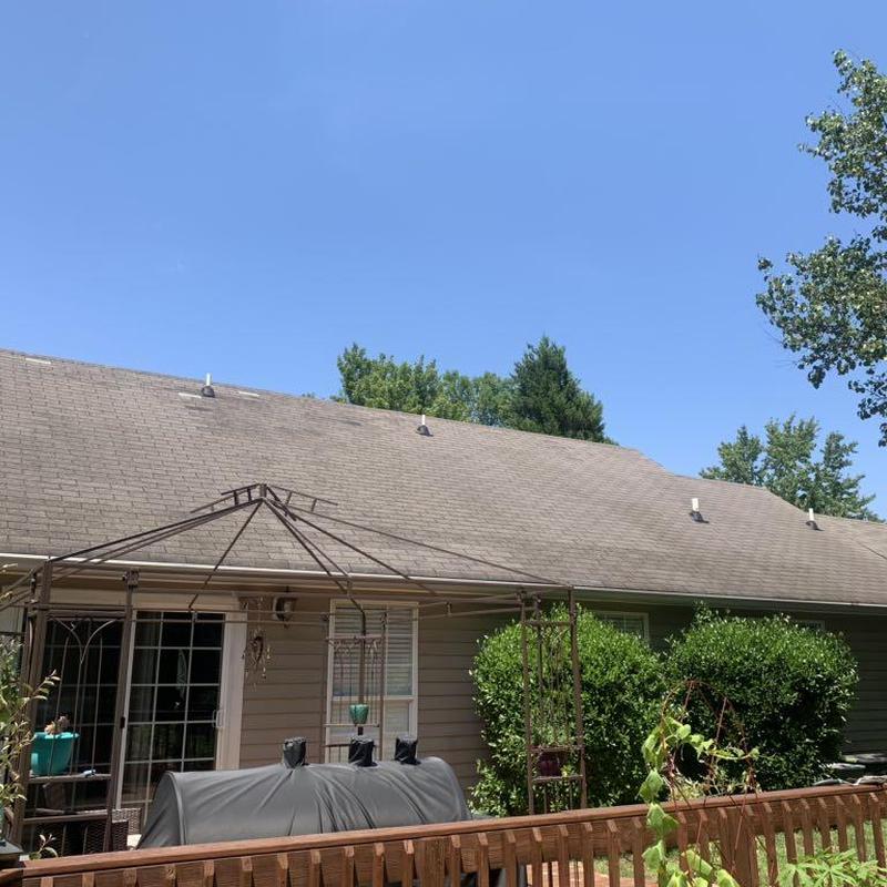 Asphalt shingle roof on residential home with patio frame