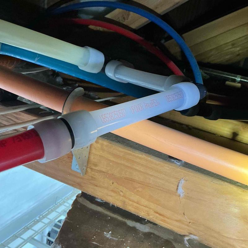 PVC plumbing tee fitting and piping replacement