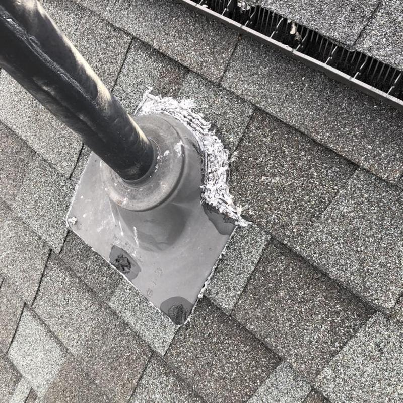 Pipe boot with sealant on asphalt shingle roof