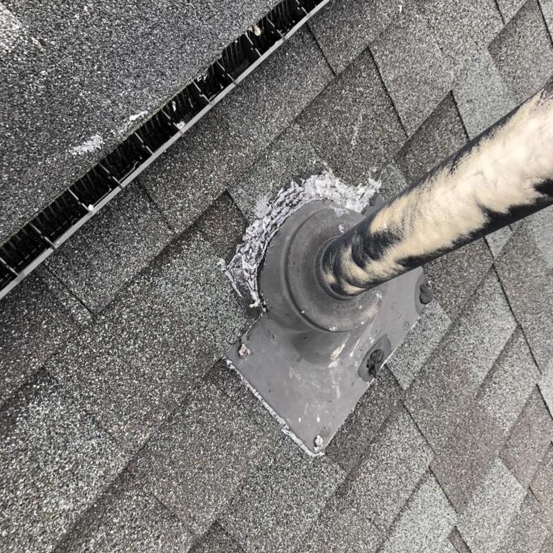 Pipe boot flashing on shingled roof with sealant