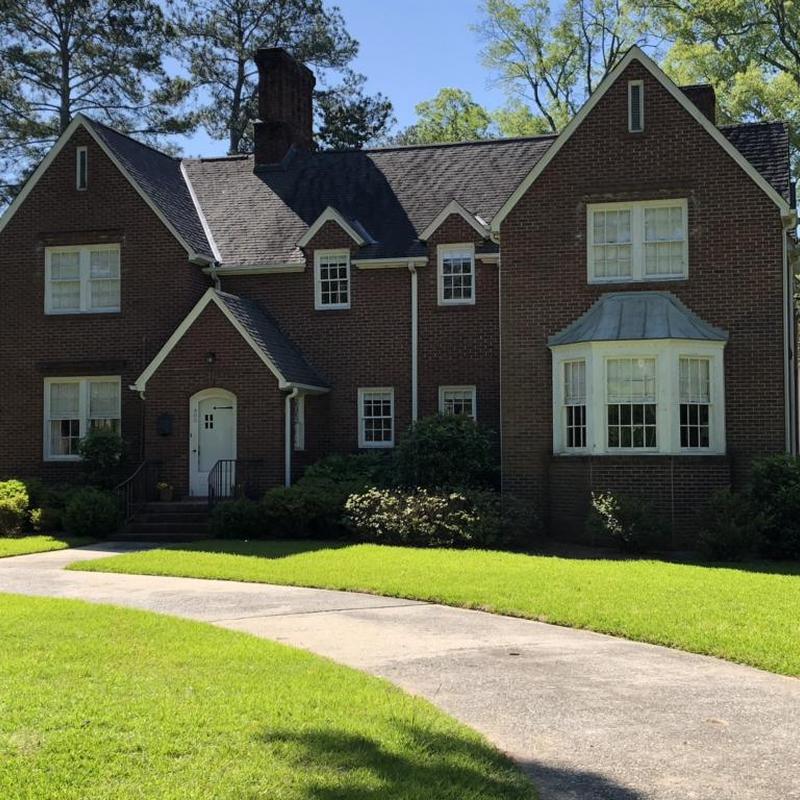 Asphalt shingle roof with pipe boot repair