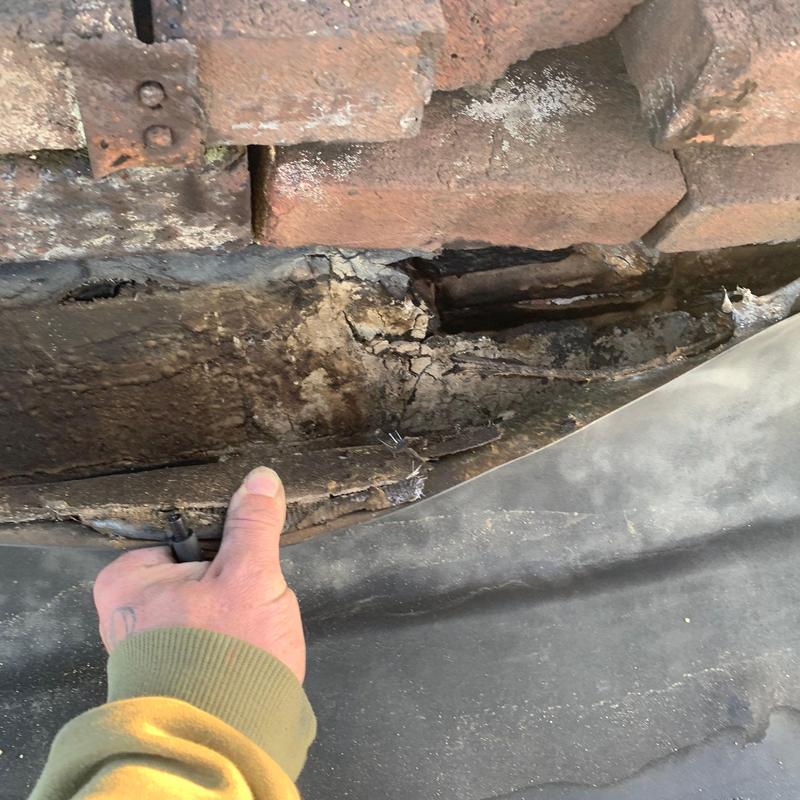 Roofing membrane with severe hail damage and cracks