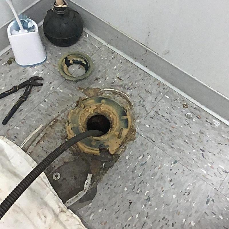 Toilet flange with drain cable and plumbing tools Toilet flange with drain cable and plumbing tools