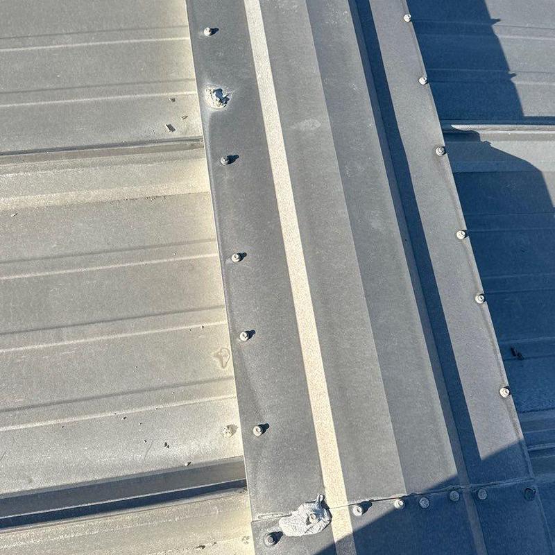 Metal roof panels with hail damage and dents