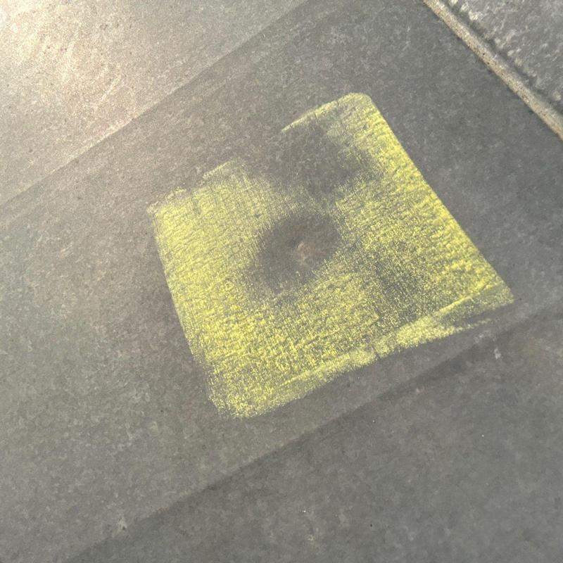 Roof shingle hail damage marked with yellow chalk