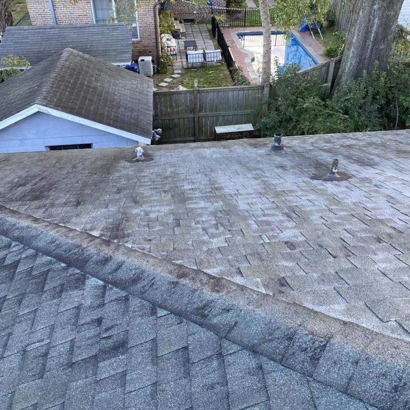 Asphalt shingle roof with wear and discoloration