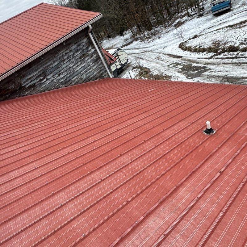 Metal roof panels inspection with vent pipe flashing