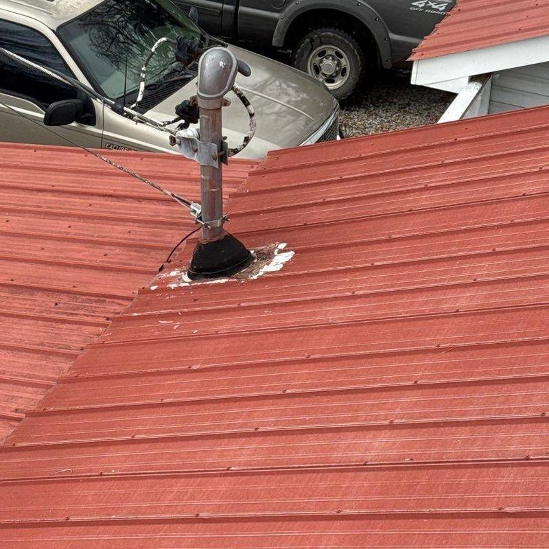Metal roof vent flashing with wear and sealant damage