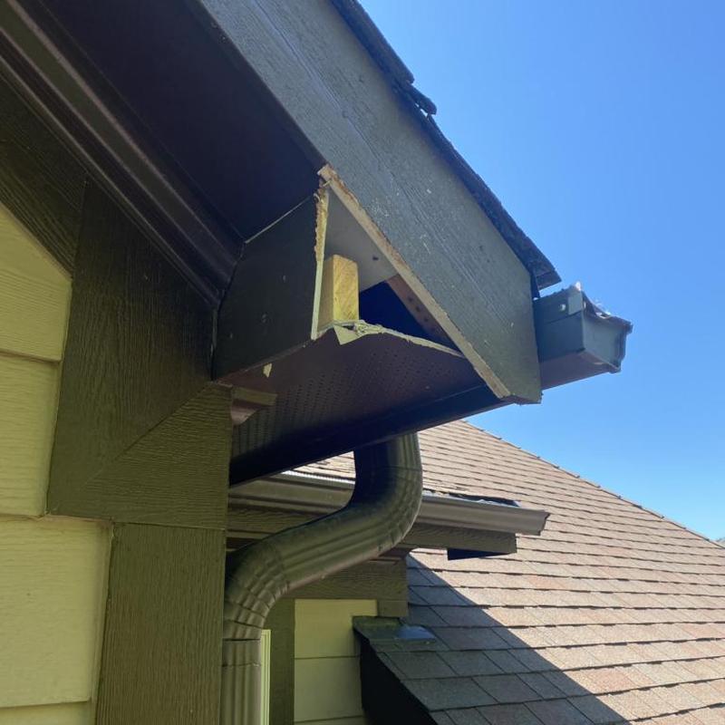 Soffit and fascia damage under gutter on roof edge