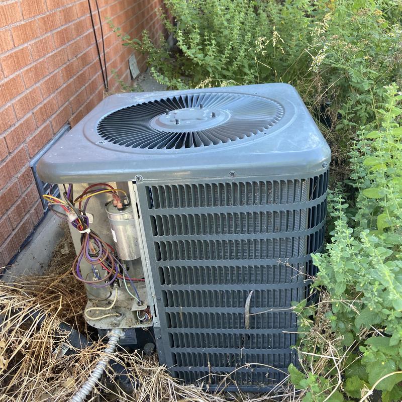 Condenser unit with dirty compressor and exposed wiring Condenser unit with dirty compressor and exposed wiring