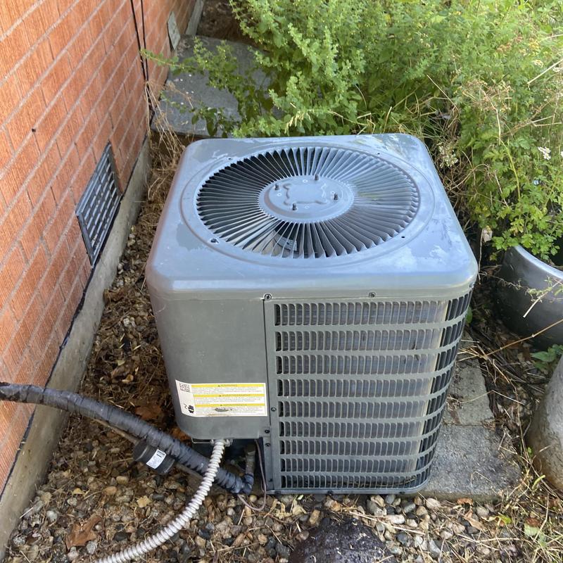 Condenser compressor unit with dirt buildup outdoors Condenser compressor unit with dirt buildup outdoors