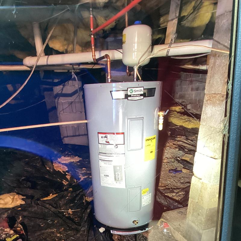Electric water heater with expansion tank installed in crawl space Electric water heater with expansion tank installed in crawl space