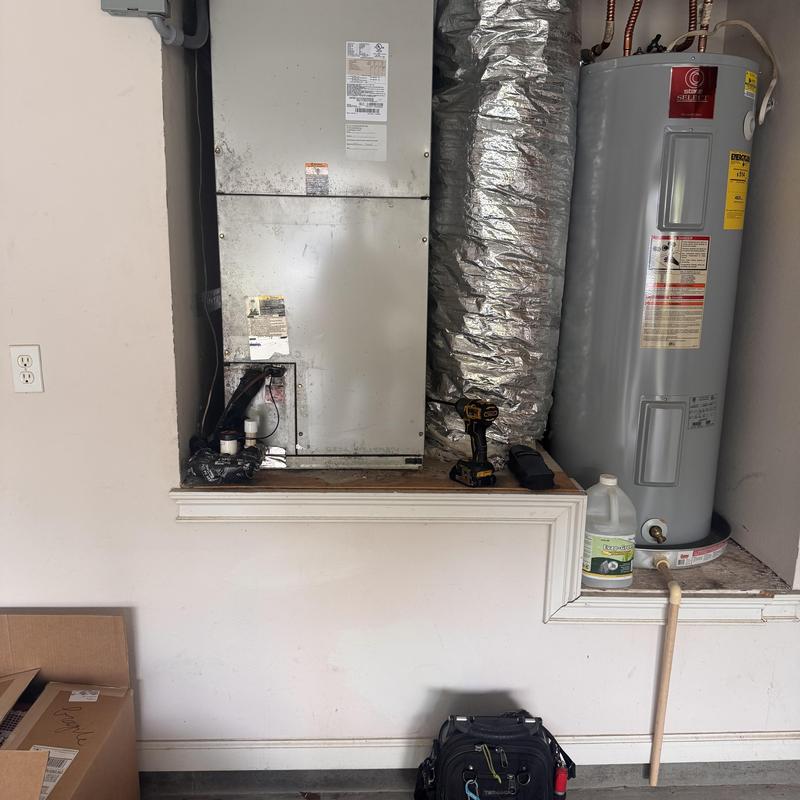 Heat pump air handler with tools and water heater