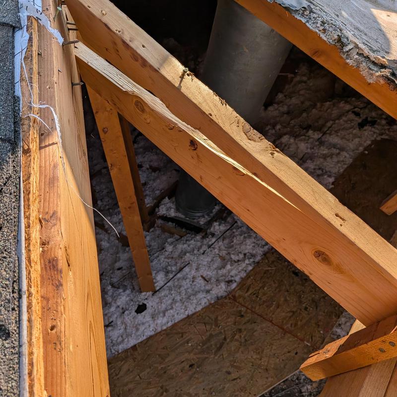 Chimney flue and wooden attic framing work