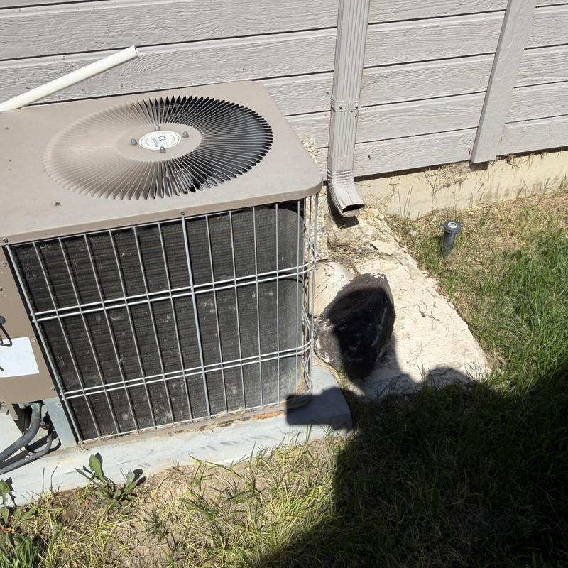 Air conditioning condenser unit outside home wall Air conditioning condenser unit outside home wall