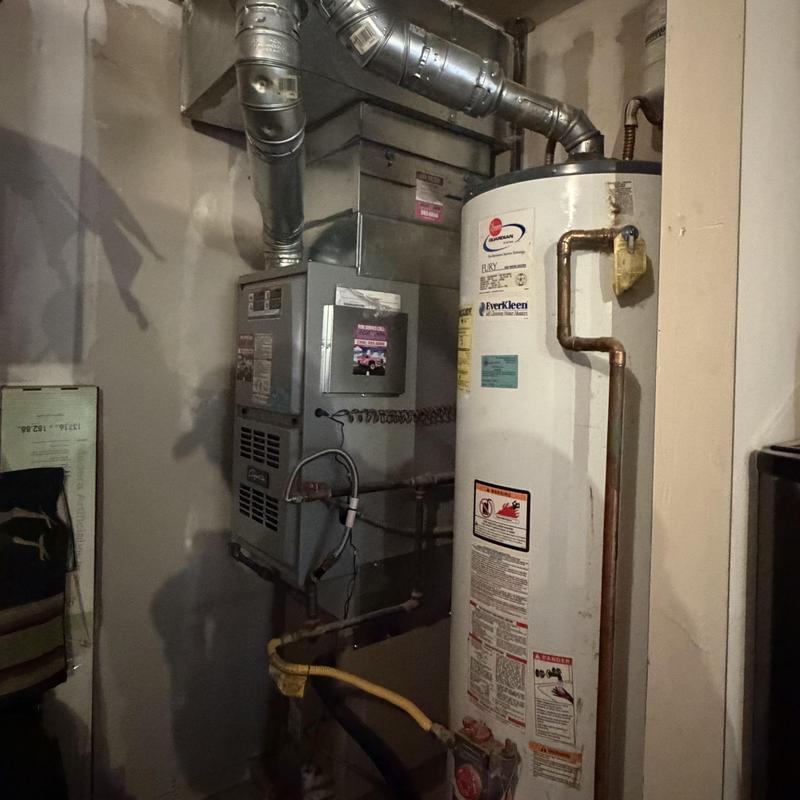 Gas water heater vent with damaged draft hood elbow Gas water heater vent with damaged draft hood elbow