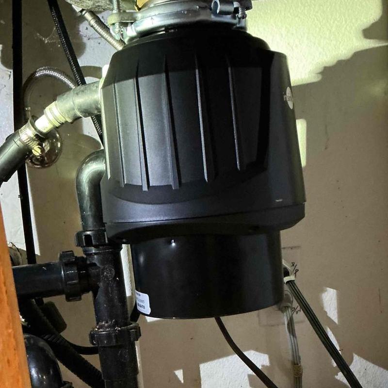 Garbage disposal unit under kitchen sink installation