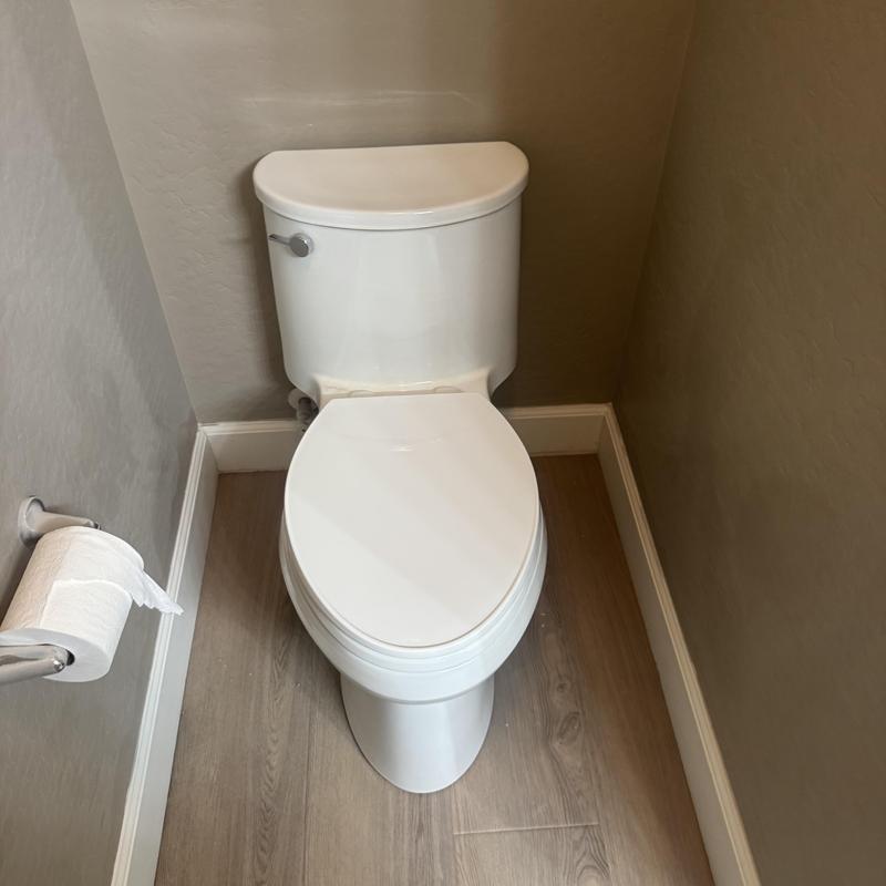 Kohler one-piece toilet installed in bathroom corner