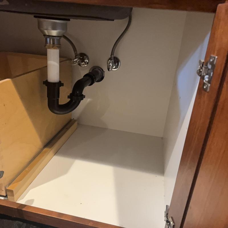 Kitchen sink drain pipes under cabinet with plumbing connections Kitchen sink drain pipes under cabinet with plumbing connections