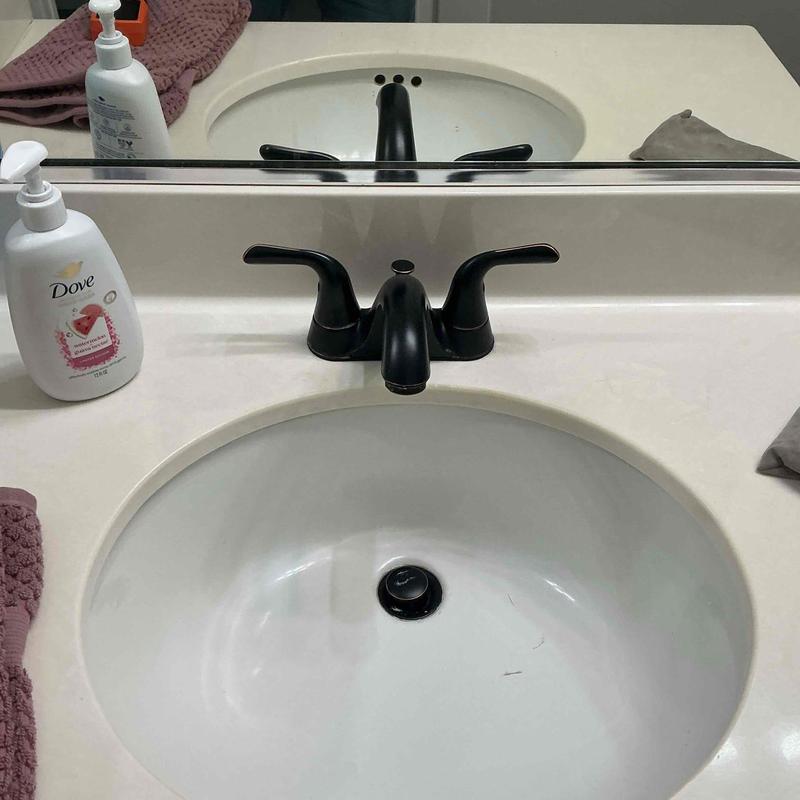 Center-set bathroom faucet with black finish installed