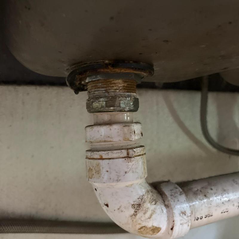 Sink drain gasket and nut with rust and corrosion