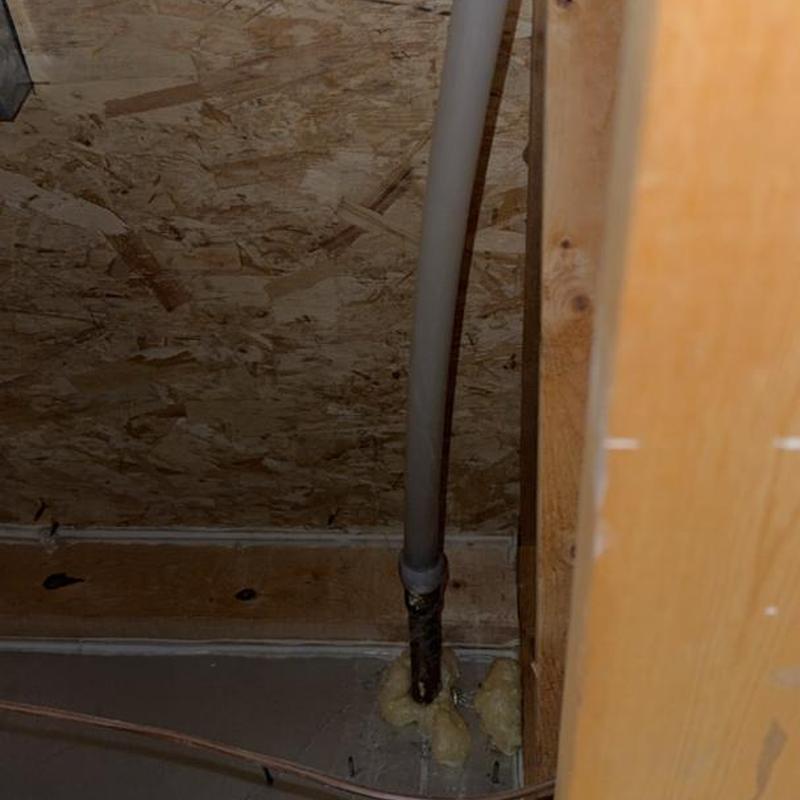 Spigot pipe replacement with insulation foam in basement