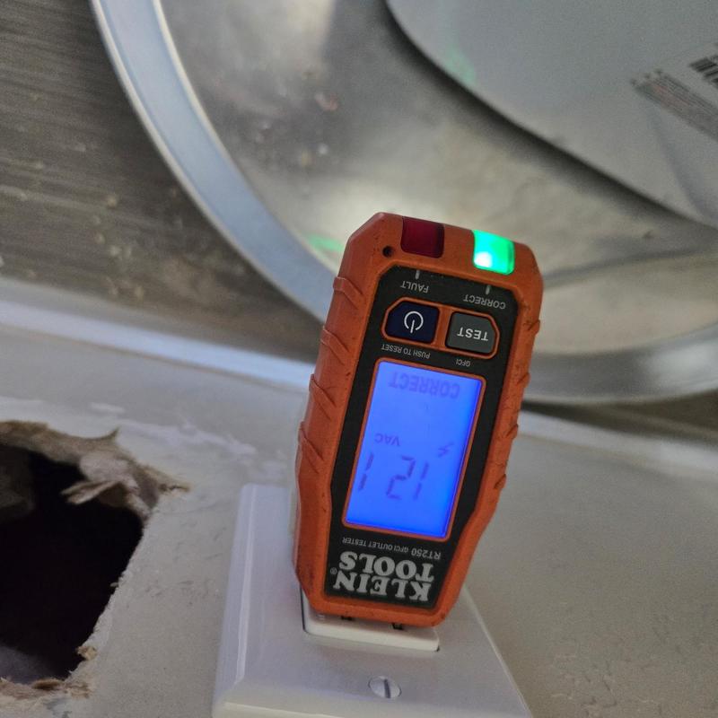 Electrical outlet voltage tester showing correct voltage Electrical outlet voltage tester showing correct voltage