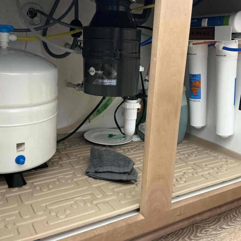 Garbage disposal installation under kitchen sink