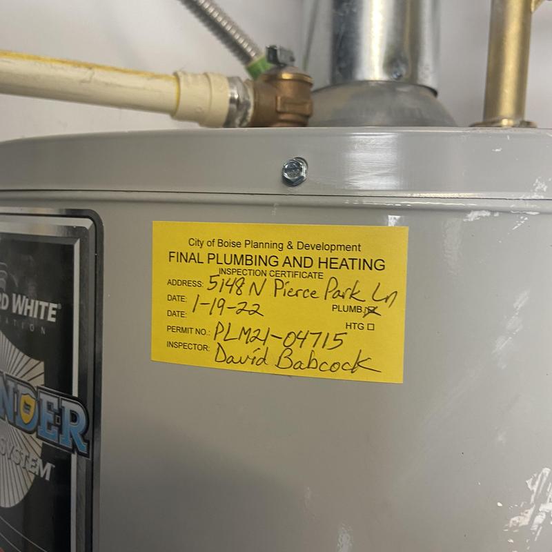 Water heater with final plumbing inspection sticker Water heater with final plumbing inspection sticker