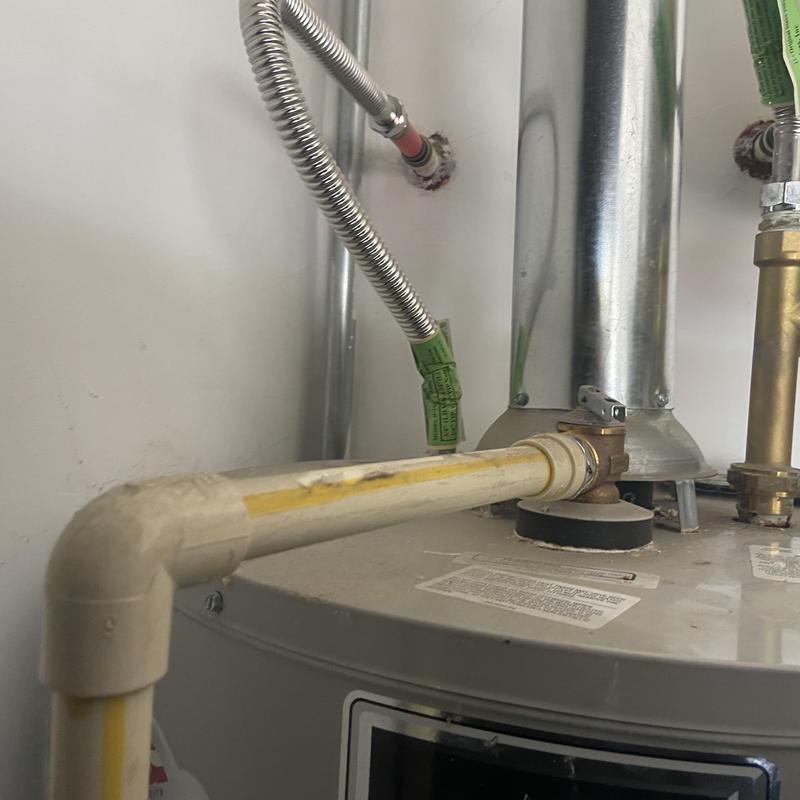 Water heater gas control valve and piping close-up Water heater gas control valve and piping close-up