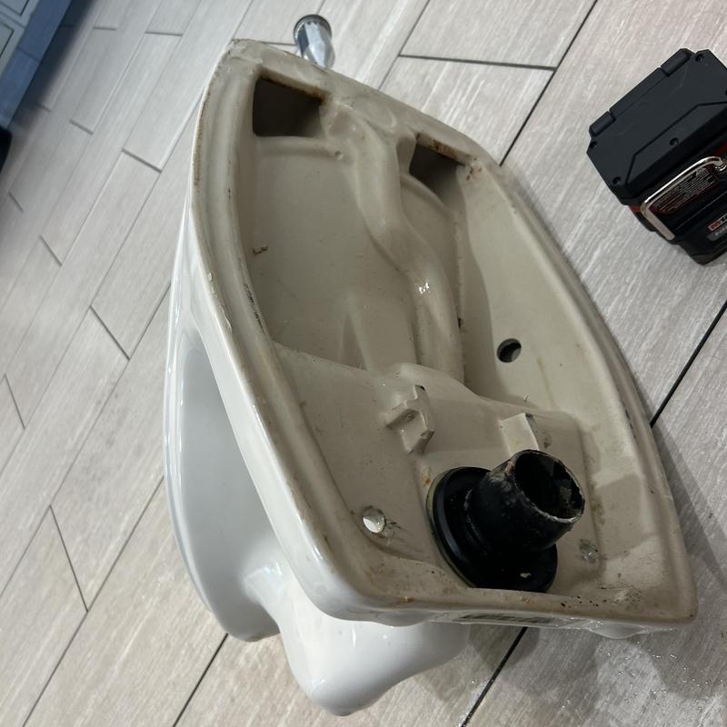 Urinal base with drain pipe pulled for inspection Urinal base with drain pipe pulled for inspection
