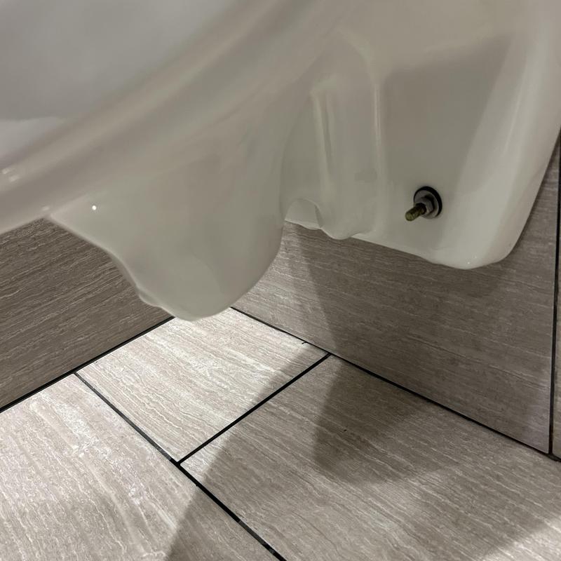 Urinal mounting bolt and wall tile inspection close-up Urinal mounting bolt and wall tile inspection close-up