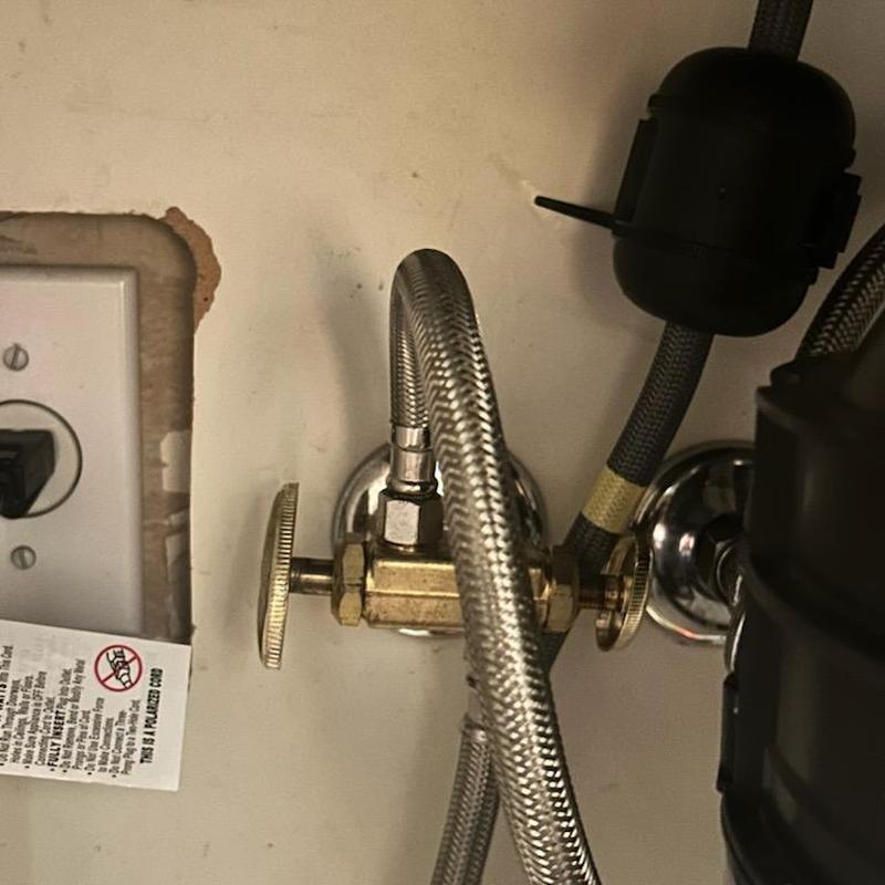 Angle stop valve with braided water supply line under sink