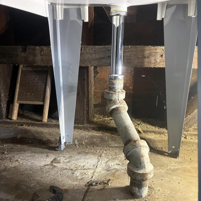 Sink drain pipe and trap under laundry tub installation