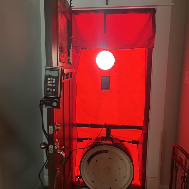 Blower door air leakage testing setup at home door