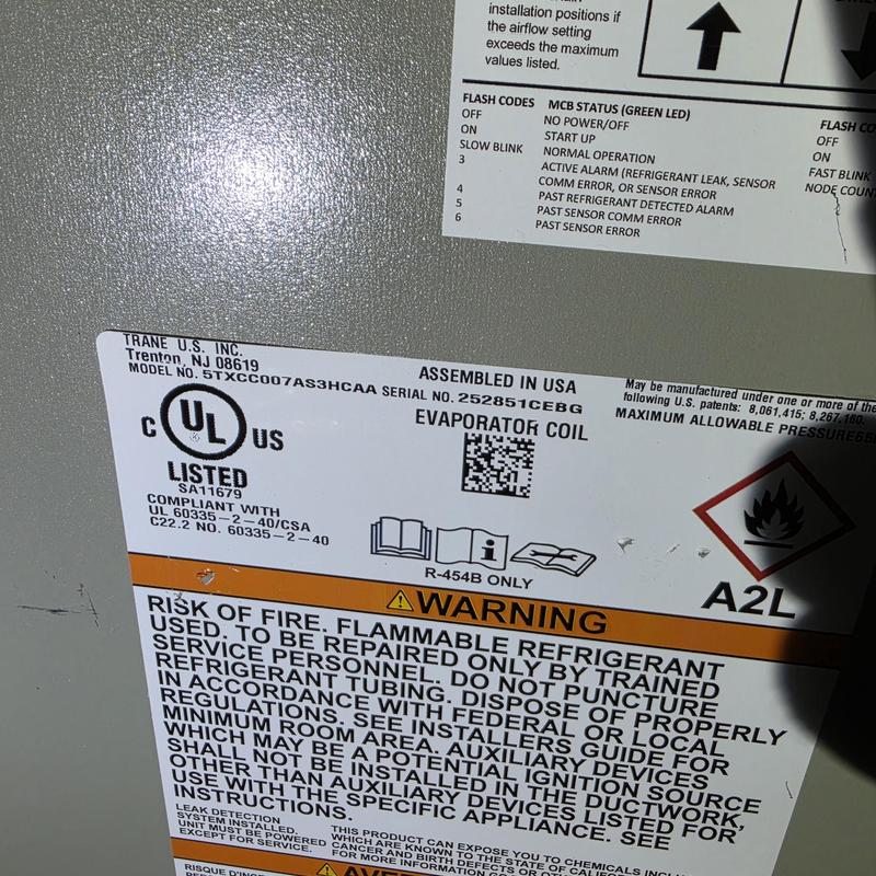 Evaporator coil warning label on Trane HVAC unit