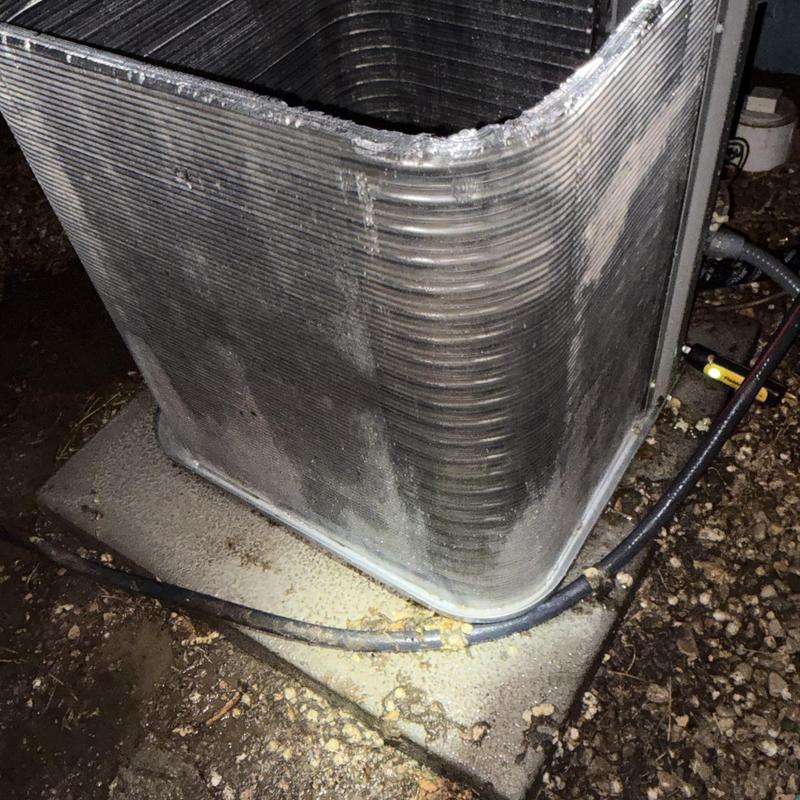 Outdoor condenser coil clogged with dust and debris Outdoor condenser coil clogged with dust and debris