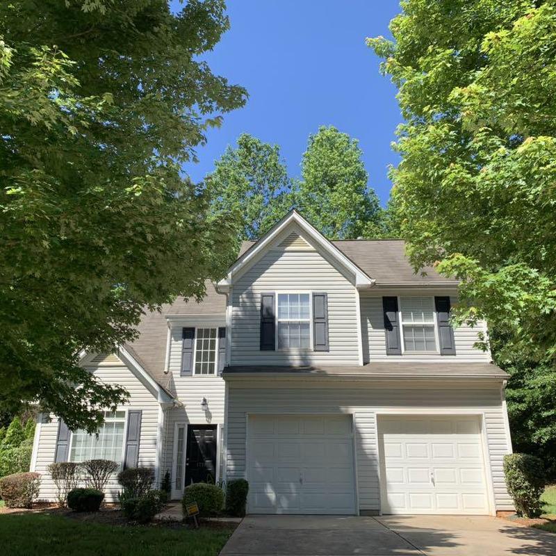 Roof and siding damage inspection on two-story home