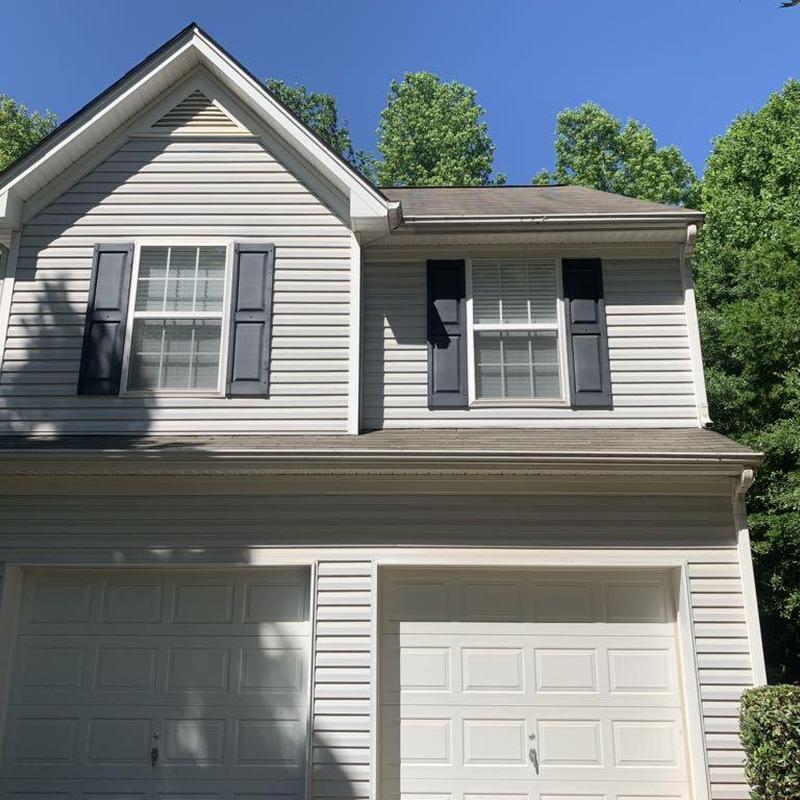 Asphalt shingle roof and siding inspection on house