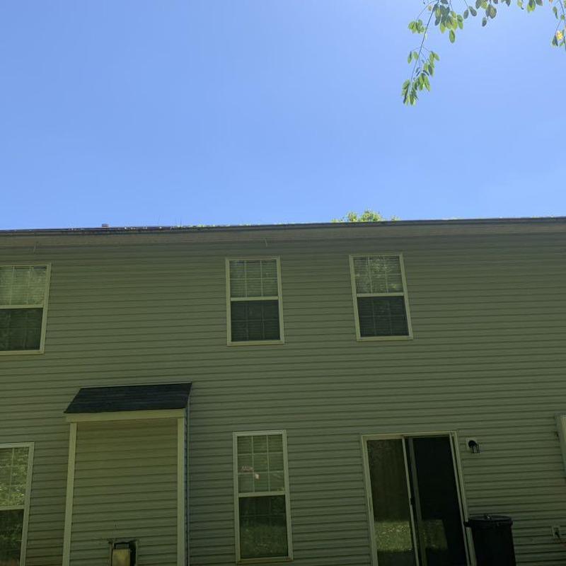 Roof shingles hail and wind damage inspection on house