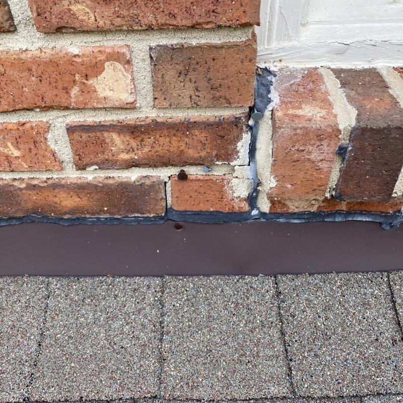 Brick mortar and roof flashing with sealant application