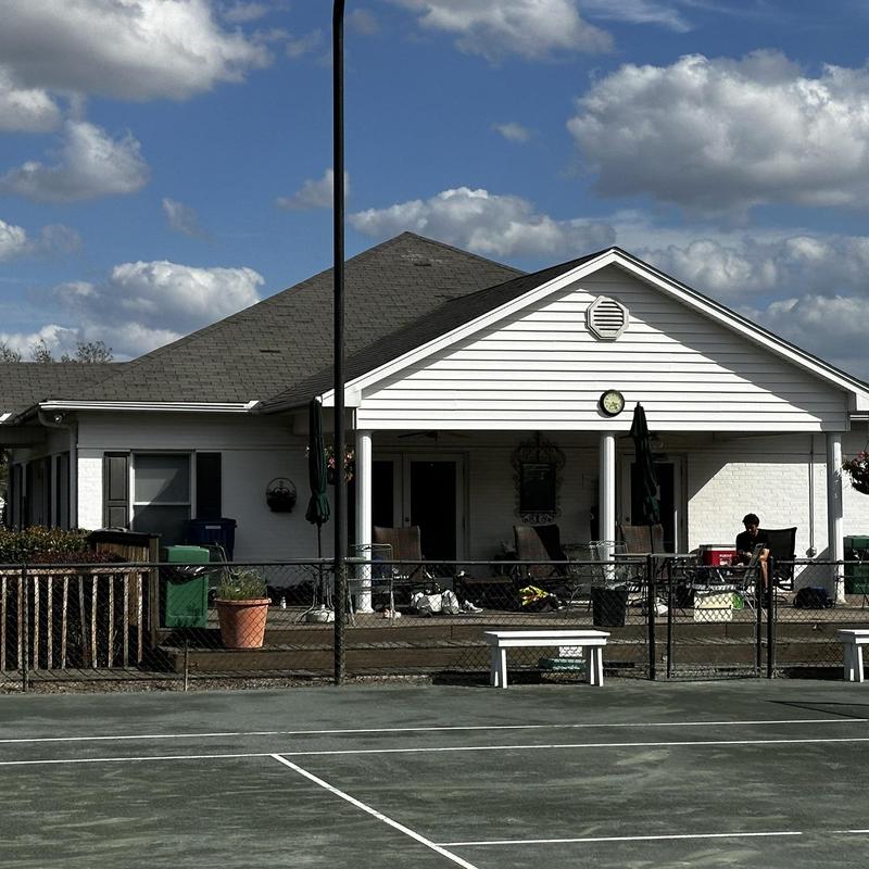 Roof shingles with visible storm damage on residential house