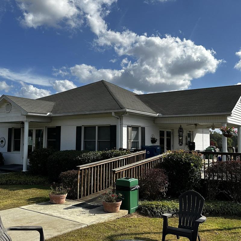 Roof shingles with hail and wind damage on residential building