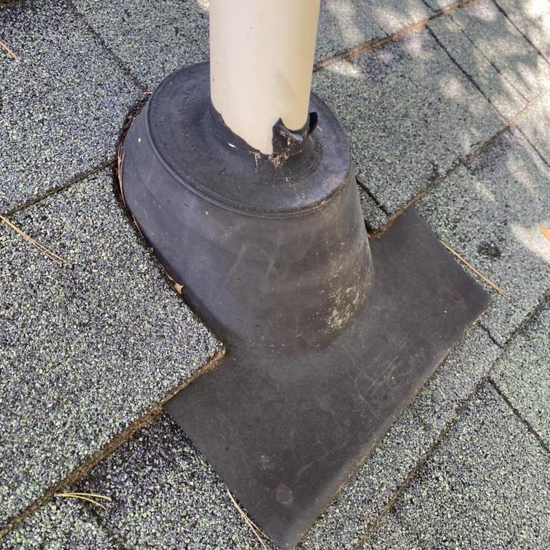 Pipe boot on shingle roof with minor damage