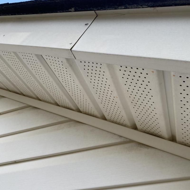 Metal bent fascia with nails and roof shingles nearby
