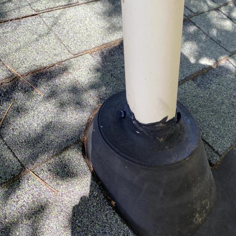 Pipe boot on shingle roof with new sealant