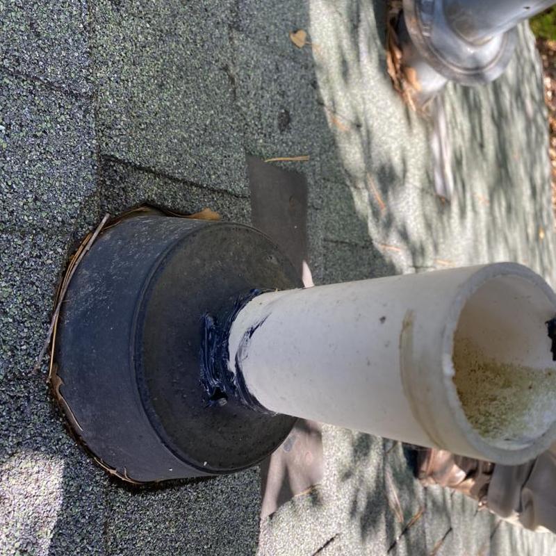 Pipe boot with sealant on asphalt shingle roof