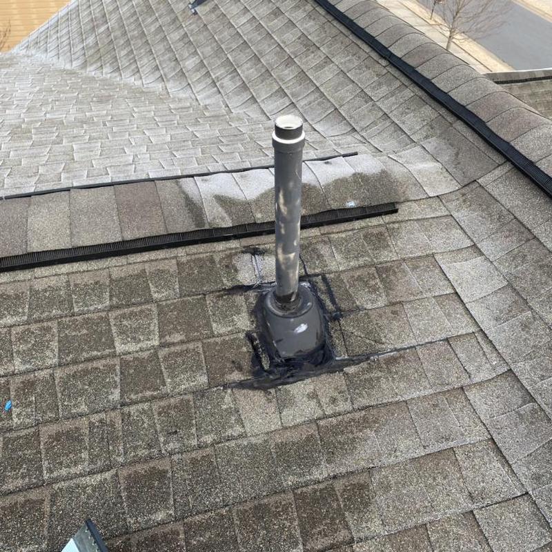 Roof vent flashing on shingle roof after repair